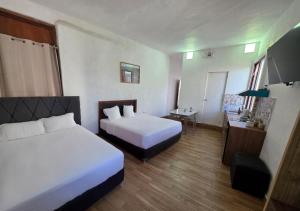 Ένα ή περισσότερα κρεβάτια σε δωμάτιο στο La Maison San LaZaro