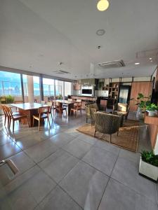 a dining room with tables and chairs in a building at Dpto excelente ubicación in Asuncion