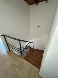 a staircase with a metal railing in a room at Refugio del Este in San Martín +8 photos