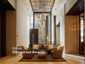 a lobby with a couch and chairs and a chandelier at Hotel The Celestine Ginza in Tokyo