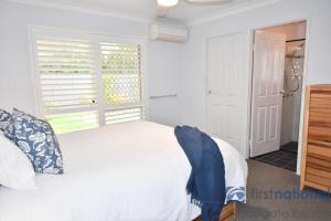 Ένα ή περισσότερα κρεβάτια σε δωμάτιο στο 4 Driftwood Place