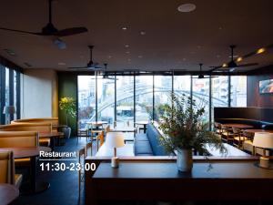 a restaurant with a lobby with tables and chairs at sequence MIYASHITA PARK - Shibuya in Tokyo