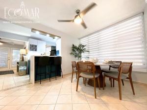 a dining room with a table and chairs at EcoMar Rentals: Villa in Cabo Rojo
