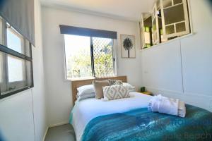 Ένα ή περισσότερα κρεβάτια σε δωμάτιο στο 10 Fifth Avenue