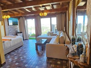 a living room with a couch and a table at rooftop studio essaouira in Essaouira