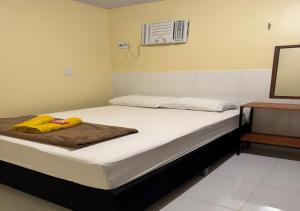 Ένα ή περισσότερα κρεβάτια σε δωμάτιο στο Figueiredo Hosp 1