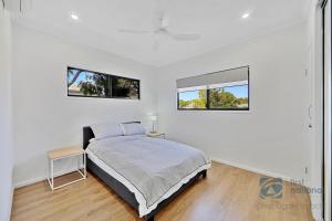 Ένα ή περισσότερα κρεβάτια σε δωμάτιο στο 7 Pine Court