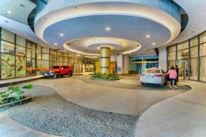 a large building with cars parked in it at Horizons 101 in Cebu City