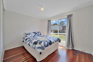 Ένα ή περισσότερα κρεβάτια σε δωμάτιο στο 3 Snapper Court