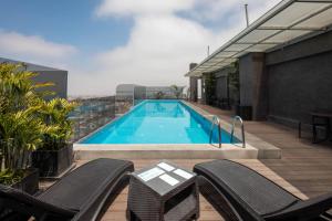 a swimming pool on top of a building at Casa Andina Select Tacna in Tacna