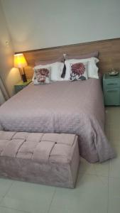 Ένα ή περισσότερα κρεβάτια σε δωμάτιο στο Apartamento no Centro de Gaspar