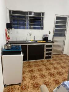 Kuchyň nebo kuchyňský kout v ubytování Casa aconchegante