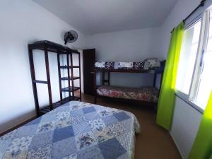 Postel nebo postele na pokoji v ubytování El Canto De Los Pájaros + 7 fotografií