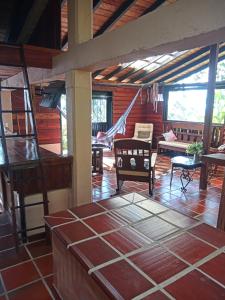 a living room with tables and chairs in a house at Paz y Tranquilidad in Marsella +10 photos