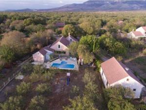 an aerial view of a house with a swimming pool at Holiday Home Marin AS with Pool in Trbounje