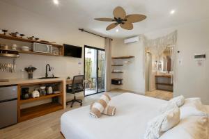 Ένα ή περισσότερα κρεβάτια σε δωμάτιο στο Casa Wayra Tulum +65 φωτογραφίες