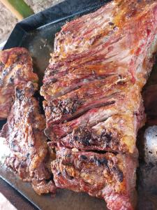 a close up of a piece of meat in a pan at La querencia in Vaqueros