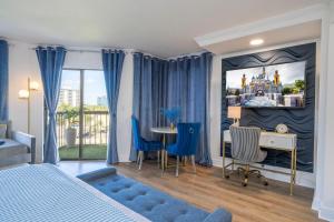 a bedroom with a bed and a table and chairs at Studio with Private Terrace and Volcano Bay View Near Epic Universe in Orlando