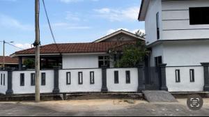 a white house with a brown roof at SK Homestay Bukit Rangin Kuantan in Kuantan