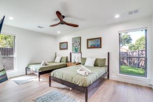 a bedroom with two beds and a ceiling fan at The Goph Getaway 4B 2B Duplex KING Pet Friendly in Richardson