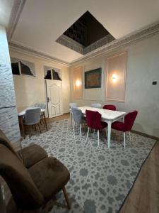 a dining room with a table and chairs at Riad 052 in Marrakesh