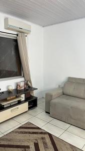 Χώρος καθιστικού στο Pousada familiar com piscina