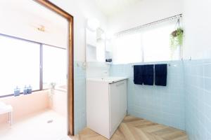 Postel nebo postele na pokoji v ubytování Ａｗａｊｉ Ｓｅａｓｉｄｅ Ｖｉｌｌａ ｉｎ Ｇｏｓｈｉｋｉ - Vacation STAY 98416v + 32 fotografií