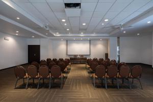 a conference room with chairs and a projection screen at Casa Andina Select Tacna in Tacna +113 photos