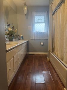 a bathroom with a sink and a window at Richmond cozy room in Richmond