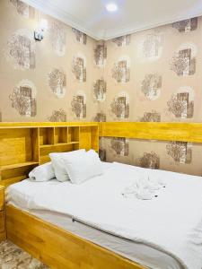 Postel nebo postele na pokoji v ubytování Por Chey Hotel