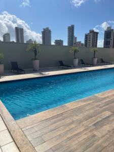 a swimming pool on the roof of a building at Apt 3 quartos com área de lazer in Belém