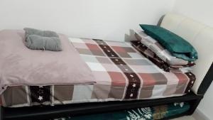 Ένα ή περισσότερα κρεβάτια σε δωμάτιο στο Canopy Hill Kajang 2