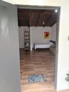 a room with a bed and a tile floor at Apartamentos GoZu # 1 in Puerto Viejo +7 photos