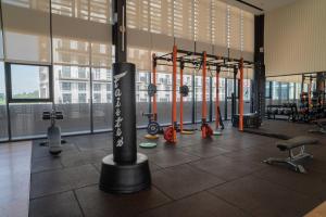 a gym with lots of exercise equipment in a building at Paxtonz Suites,1Utama,IKEA Damansara,SEGi,Desa Park in Petaling Jaya