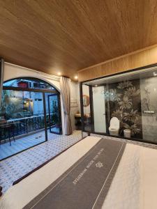 a hotel room with a view of a patio at Villa Full House in Vũ Lâm +9 photos