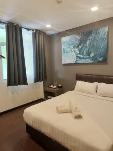 Postel nebo postele na pokoji v ubytování Sogo Hotel l