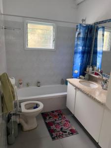 a bathroom with a toilet and a sink at Happy Place in Tel Aviv