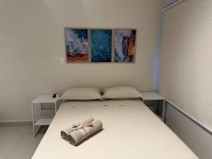 Ένα ή περισσότερα κρεβάτια σε δωμάτιο στο Apartamento com saída para praia