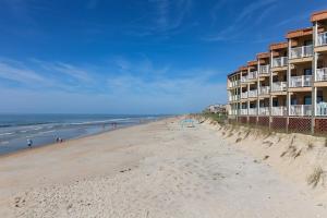 a view of a beach with a hotel at Coast is Clear- Oceanfront Escape at Topsail Dunes in North Topsail Beach