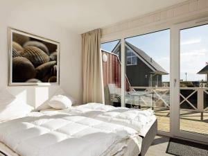 En eller flere senge i et værelse på 6 person holiday home in Wendtorf