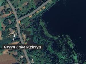 an overhead view of a river and a road at Green Lake Sigiriya in Sigiriya +40 photos