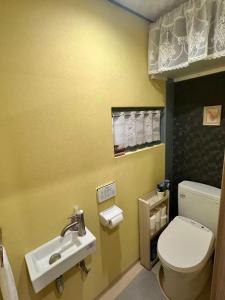 a bathroom with a toilet and a sink at 時の宿 in Kawagoe +9 photos