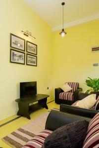 a living room with two couches and a coffee table at Villa302 in Galle