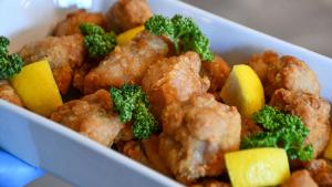 a white bowl of food with broccoli and cauliflower at Kotoni Green Hotel in Sapporo