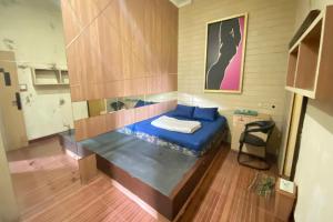 a small room with a bed in a room at Hotel O near Maguwoharjo Stadium formerly Graha Ngaso in Seturan