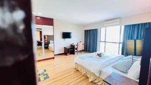 Ένα ή περισσότερα κρεβάτια σε δωμάτιο στο GR SUITE Family Room +30 φωτογραφίες