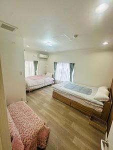 Postel nebo postele na pokoji v ubytování Villa Koedo