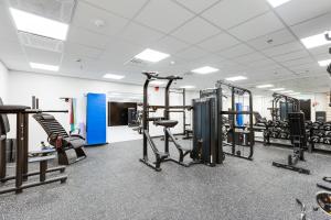 a gym with several treadmills and machines at Cranberry C11 Levi Center incl 2 ski passes by Aavalevi in Levi