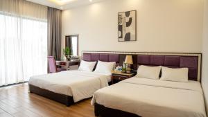 Postel nebo postele na pokoji v ubytování Son Tra homestay