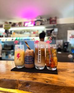 a tray with four different types of drinks on a table at North Shore Surf Camp in Baler +59 photos